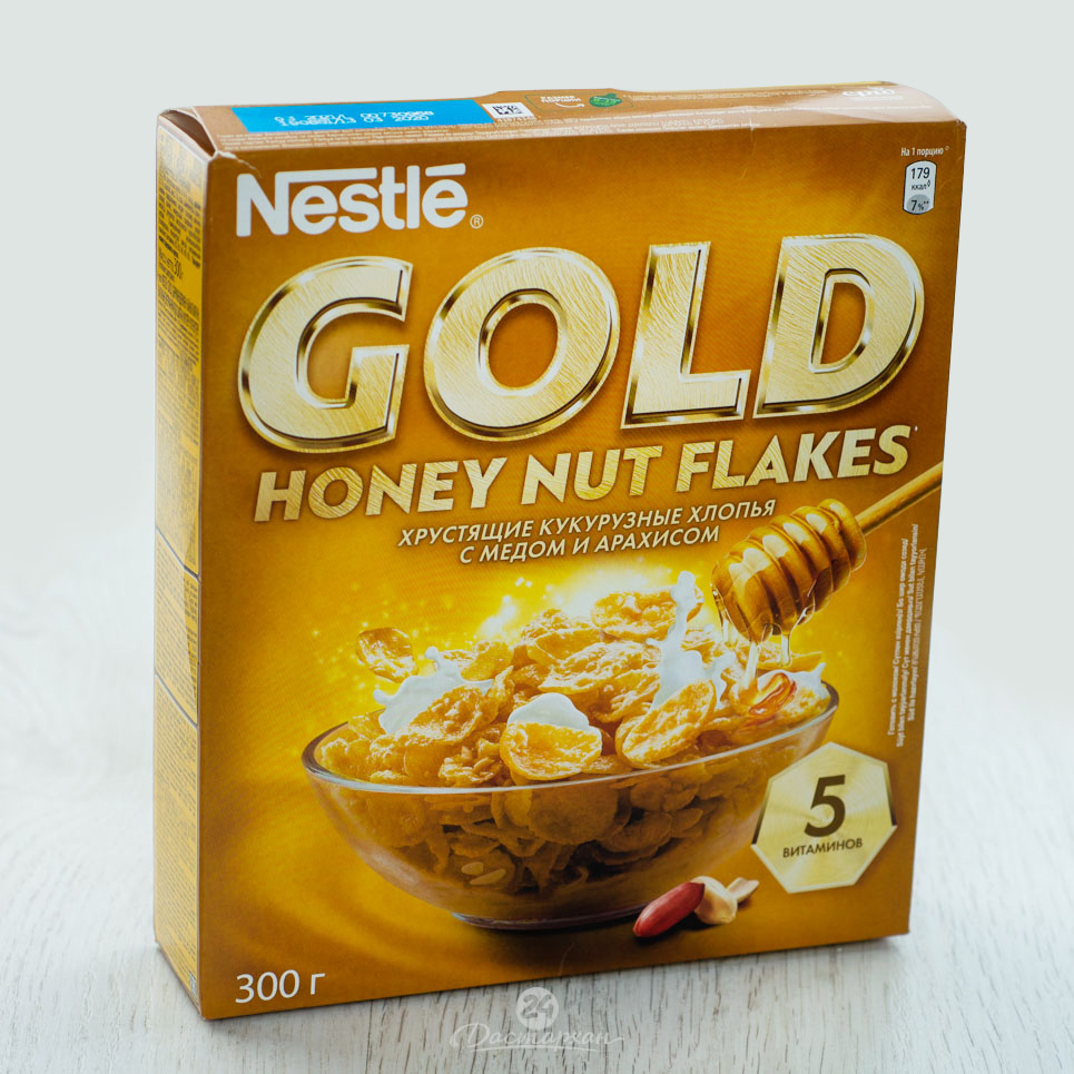 Сухой завтрак Nestle Gold хлопья кукруз.с медом и орехами 300г картон